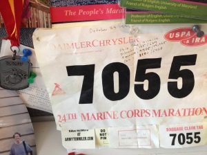 The Madwoman's finisher's medal and race bib from 1999 Marine Corps Marathon.
